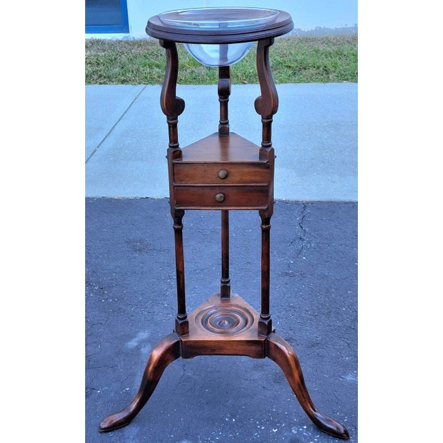 A Queen Anne Style Mahogany Washstand with Glass Bowl. Also used as a plant stand . Measures 20" in width, 20" in depth...