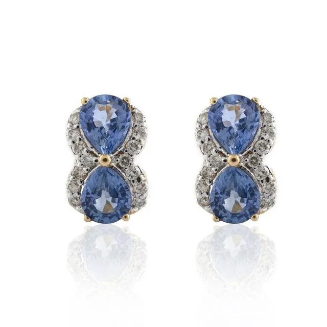 This is part of Chairish’s Fine Jewelry assortment. Natural Diamond and Blue Sapphire Pushback Stud Earrings in 14K Gold....