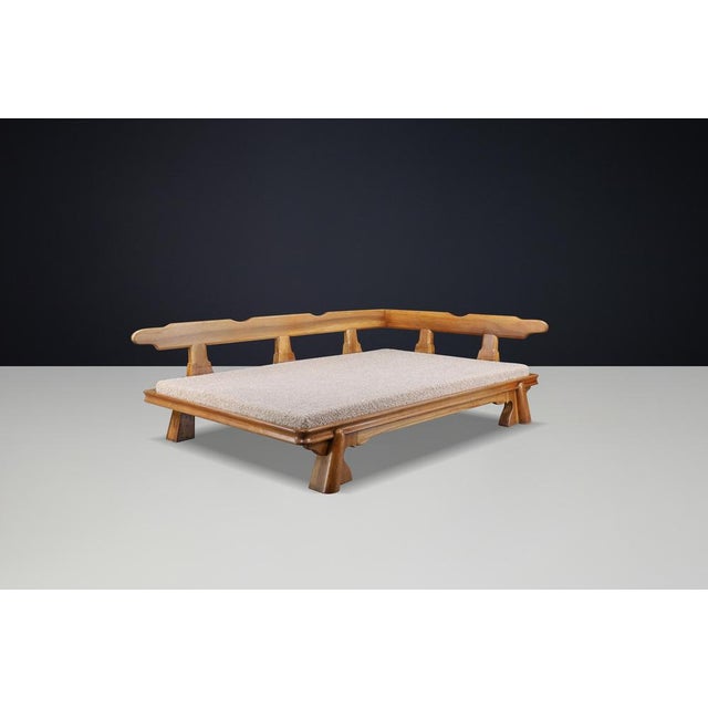 Monumental French Brutalist Walnut Daybed, Sculptural with Teddy Bouclé Upholstery, France, 1950s A rare and commanding...