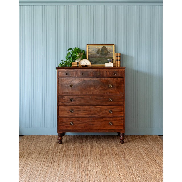 A striking early 19th-century American figured mahogany chest of drawers, dating to the Late Classical / Empire period,...