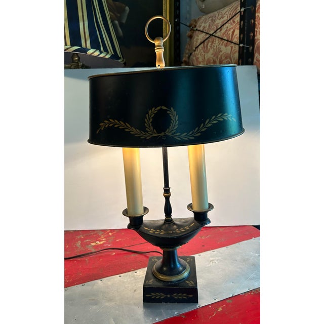 A circa 1960 hand painted tole metal lamp.