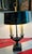 A circa 1960 hand painted tole metal lamp.