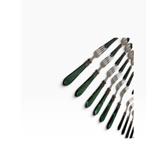 Elevate your tablescape with this stunning 29-piece vintage flatware set manufactured by the prestigious French...