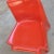 This plastic orange stacking chair, model B1171, was designed by Helmut Bätzner and manufactured by Bofinger. I have...