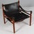 Arne Norell safari chair. Original upholstered foam cushions with patinated leather. Frame of rosewood. Model Scirocco,...