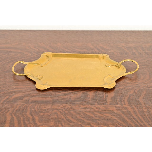 A gorgeous Arts & Crafts period hand hammered brass serving tray with handles In the manner of Liberty & Co. England,...