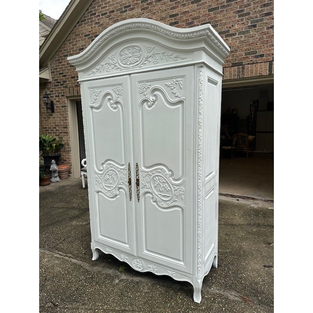 This Hendricks Armoire has been professionally spray painted white and is in excellent condition. It is a beautiful piece...