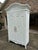 This Hendricks Armoire has been professionally spray painted white and is in excellent condition. It is a beautiful piece...