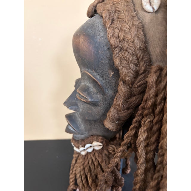 Dan Mask from the 20th century. Shows signs of aging. It is from Ivory Coast. It measures 10 inches height , and 5.5...