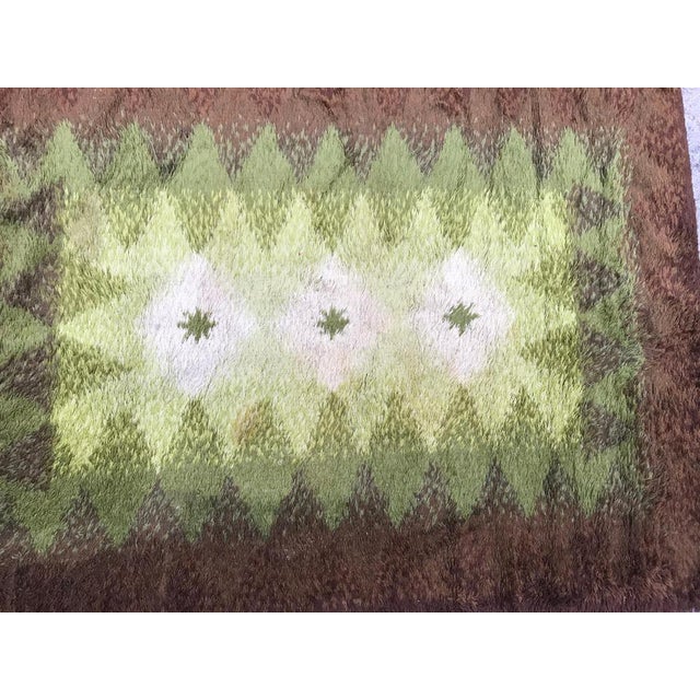 Beautiful vintage 1970s rug with a beautiful modern design and nice colors with brown and green, mechanical fabric...