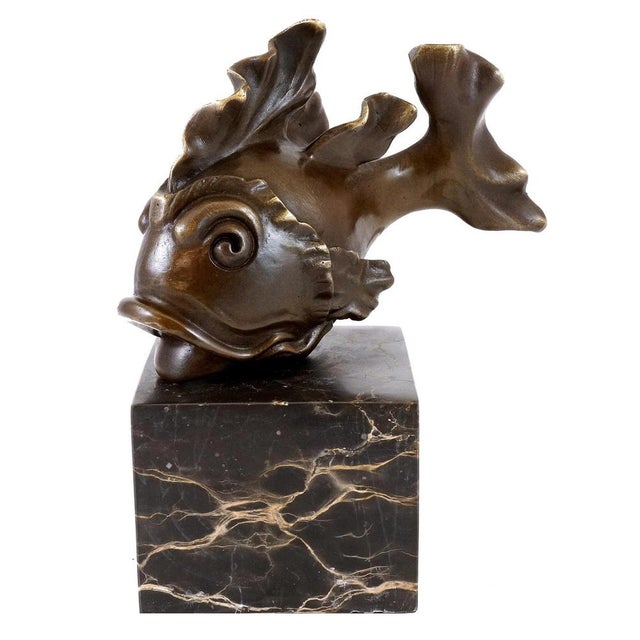 Add a touch of elegance and charm to your décor with this bronze goldfish. Every detail, from the delicate fins to the...