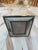 A vintage tabletop picture frame with a wide, mitered horn surround set between slim metal borders. The warm cream and...