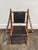 Charming solid teak and leather folding chair. Carved to resemble bamboo. Quality leather in dark brown. Measures 22"W ×...