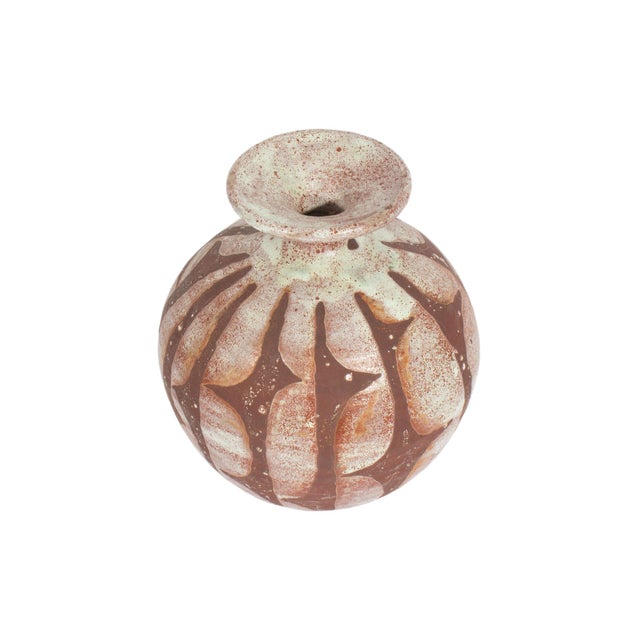 A signed studio pottery vase by American artists George and Ilana Dabbikeh. This rounded vase has a brown abstract pattern...