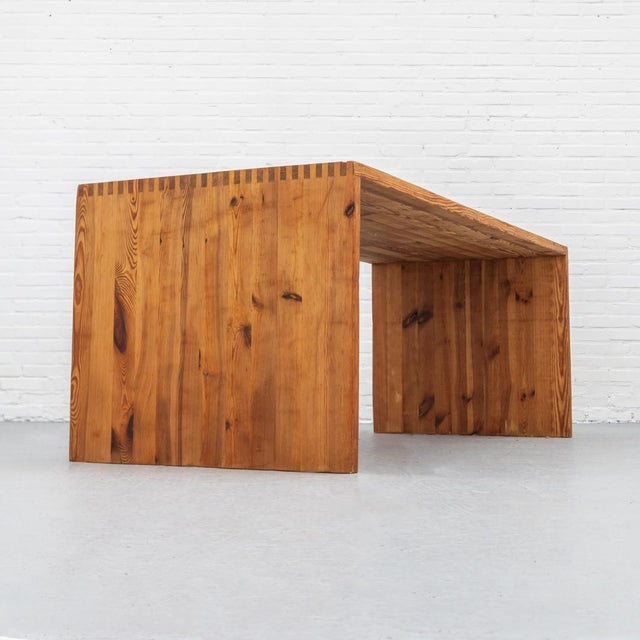 Solid pine dining table by Ate van Apeldoorn, produced by Houtwerk Hattem in the 1970s. The exposed joinery along the...