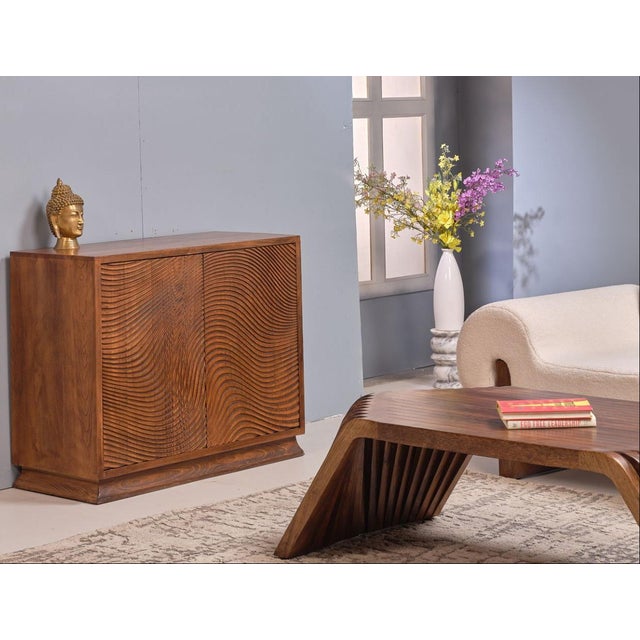 The Morley Two Doors Wood Accent Cabinet brings warm, natural wood character and practical compartmented storage to any...
