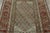Hand-knotted in wool, this antique Persian Kurdish rug is a compelling example of tribal craftsmanship, celebrated for its...