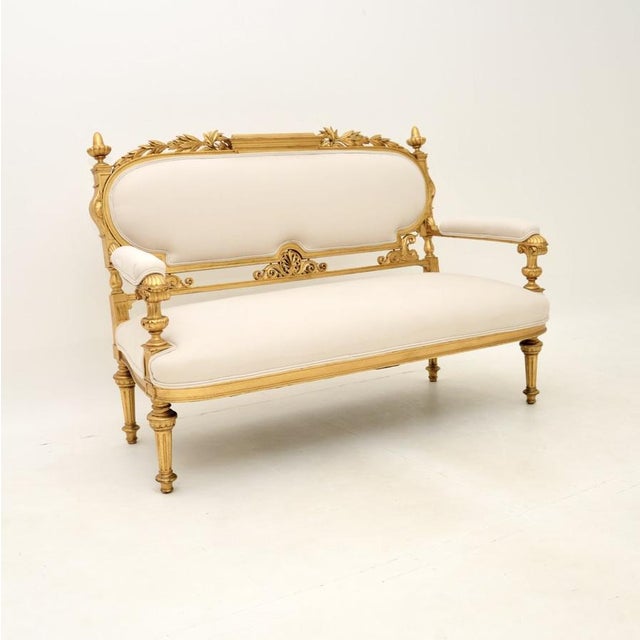 An incredibly beautiful antique Swedish Empire gilt wood settee. This was recently imported from Sweden, we would date it...