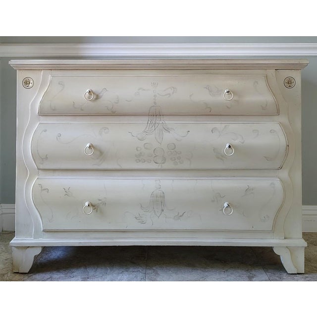 Inspired by French Provincial designs with ornate carvings of rococo style, this chest is made by Ethan Allen in the...