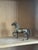 Vintage cast brass horse figurine in a prancing pose with detailed mane, bridle, and musculature. Warm aged brass finish...