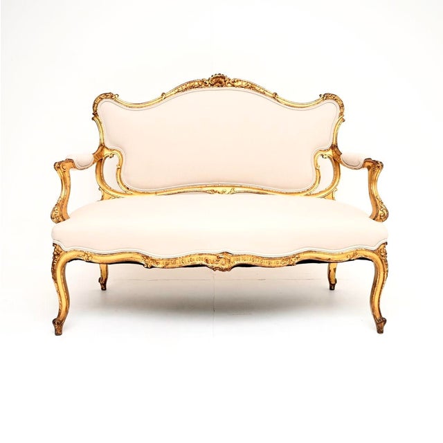 An absolutely stunning antique French carved gilt wood settee. This was made in France, it dates from around the 1890-1910...