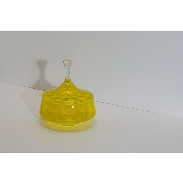 A Stelvia Empoli glass apothecary jar, handcrafted in Italy during the 1950s. Rendered in a striking neon yellow, this...