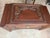 This is a heavily carved Chinese camphor wood chest made for the export market featuring intricate high relief scenes of...