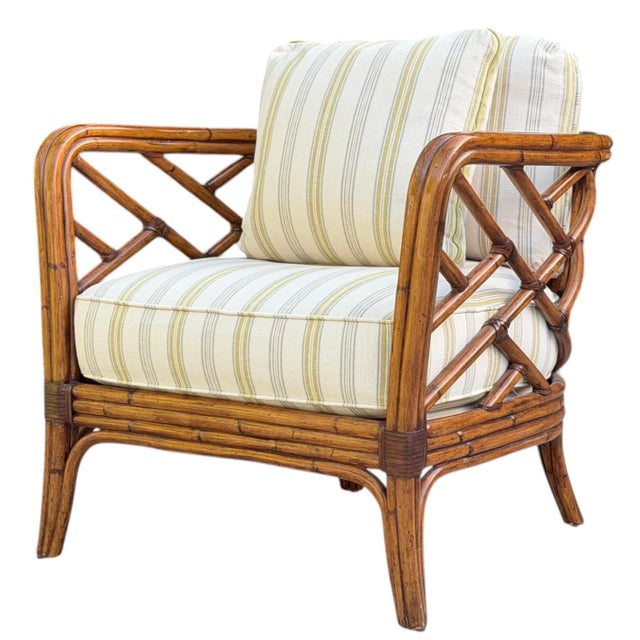 A Custom Upholstered Tommy Bahama Club Chair featuring an intricate faux-bamboo frame in a rich plantation style finish...