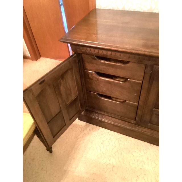This maple colored sturdy but elegant sideboard enhanced the look of our dining room since our purchase from Carafiol, an...