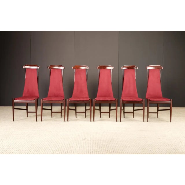 A refined and sculptural set of six dining chairs by Brazilian modernist Sergio Rodrigues, produced during the 1950s....
