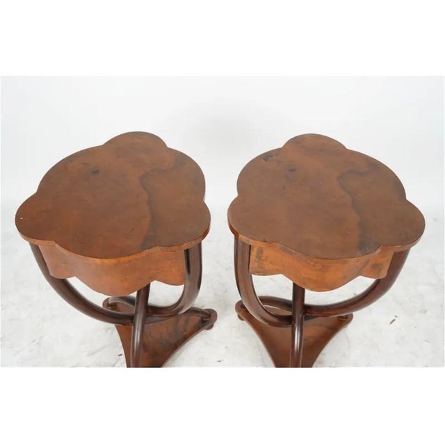 This unique side table features Art Deco styling with its interesting base crafted with three curved and twisted wooden...