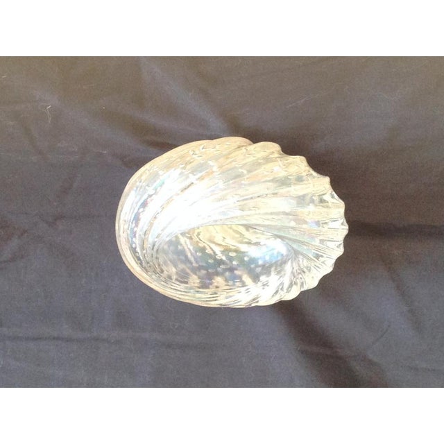 Heavy glass ashtray with iridescent bubbles, Barovier, Murano, Italy. Being an object of everyday use, considering its...