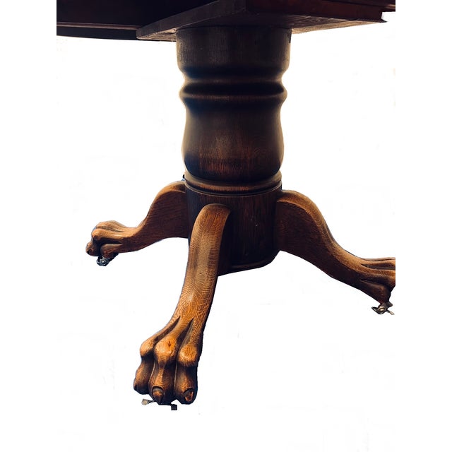 This striking solid tiger oak dining table showcases a quarter-sawn top with a classic ogee edge and stands on impressive...