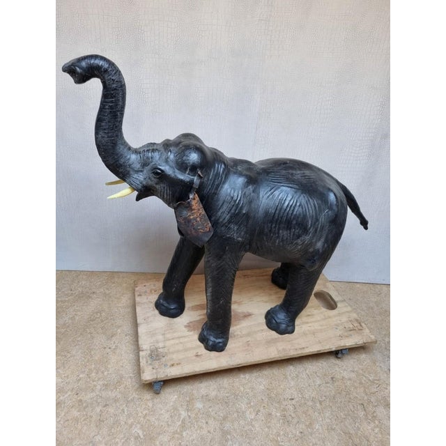 This is a large and superb quality hand made vintage leather elephant sculpture in lovely worn condition and a desirable...