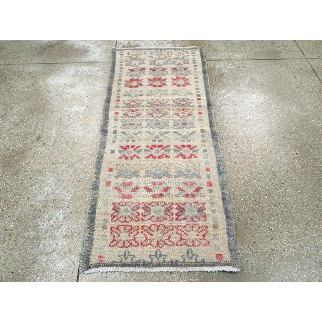 A vintage Turkish Anatolian throw rug handmade during the Mid-20th century. Measures: 2' 4" x 5' 4"