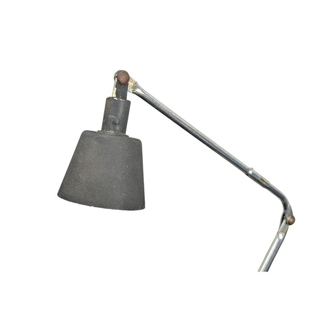 This adjustable desk lamp by Tensor (Model Princess 7100) features an iconic mid-century industrial design, featuring a...