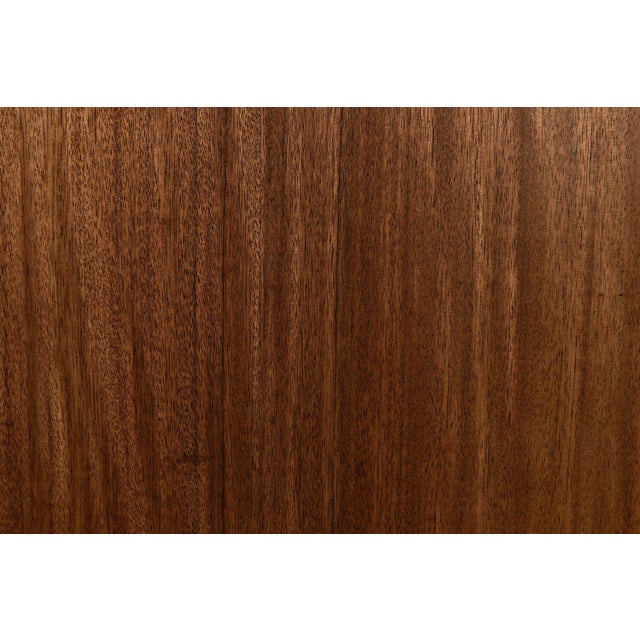 This walnut chest has simple, clean lines, and an intriguing ripple like effect that flows across its face. The chest is...