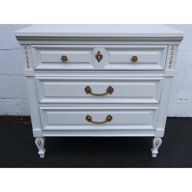 This beautiful Nightstand is made of wood. It was made by Dixie Furniture and it is stamped. This gorgeous End Table...