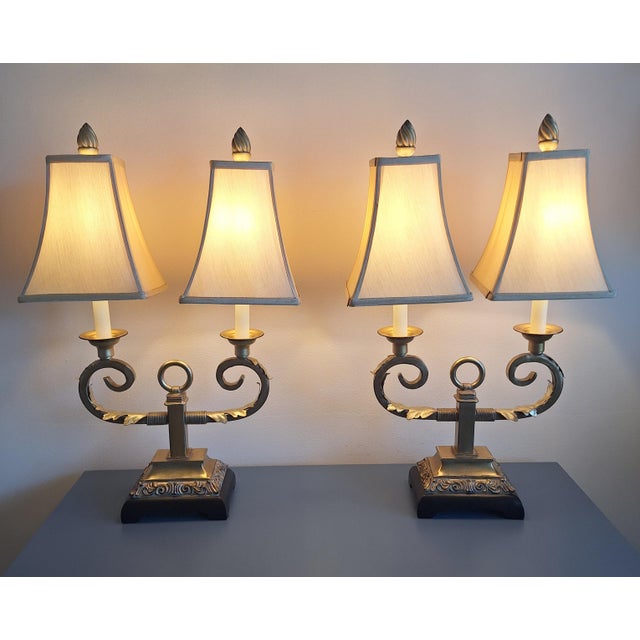 Up for consideration is a striking, highly collectible pair of mid-century twin table lamps heavily echoing the grand...