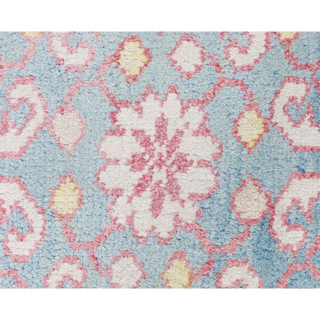 This vintage cotton Agra rug showcases exquisite craftsmanship with a detailed all-over pattern inspired by traditional...