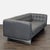 This Jason Furniture 3-seat sofa features a stylish modern design with dark gray leather upholstery and tufted back and...