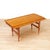 A metamorphic coffee/dining table or otherwise called the Danish "elevator" model from Trioh. This magnificent piece of...