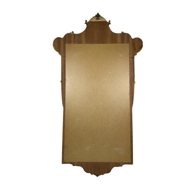 Amazing wall decorative mirror. Made in Italy in the 1950s. Wooden and metal frame. The mirror has a characteristic shape...