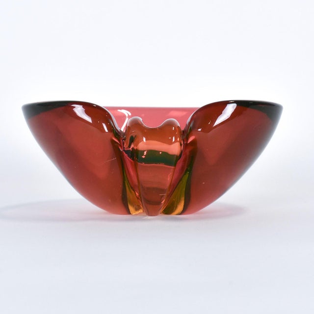 This red & green Murano style bowl is from Italy and features uranium glass. It is unmarked but was imported from Italy...