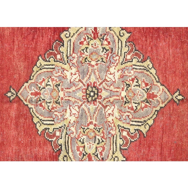 Hand-woven wool on wool foundation in Turkey's Oushak region, this 4'10" x 11'2"&nbsp;vintage rug exemplifies authentic...
