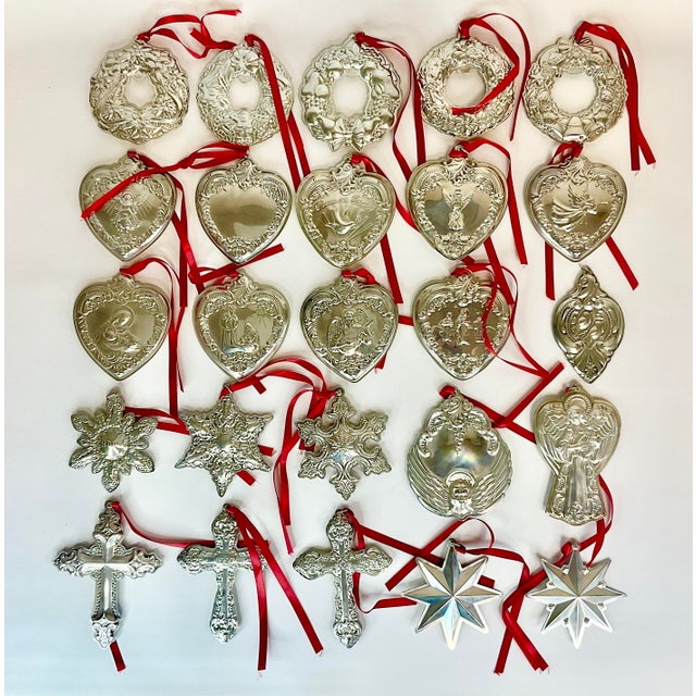Vintage Home is pleased to present this collection of 25 Wallace Sterling Silver Christmas Ornaments with Red ribbons. The...