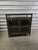 Low Industriial Style Curio Cabinet. Made from sleek gunmetal-finished iron, shadowbox-style cabinetry gives your inner...