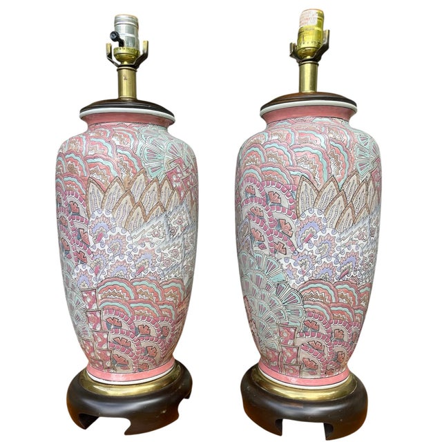 Pair of vintage Frederick Cooper Chicago porcelain table lamps featuring an intricate allover patterned design in pink,...