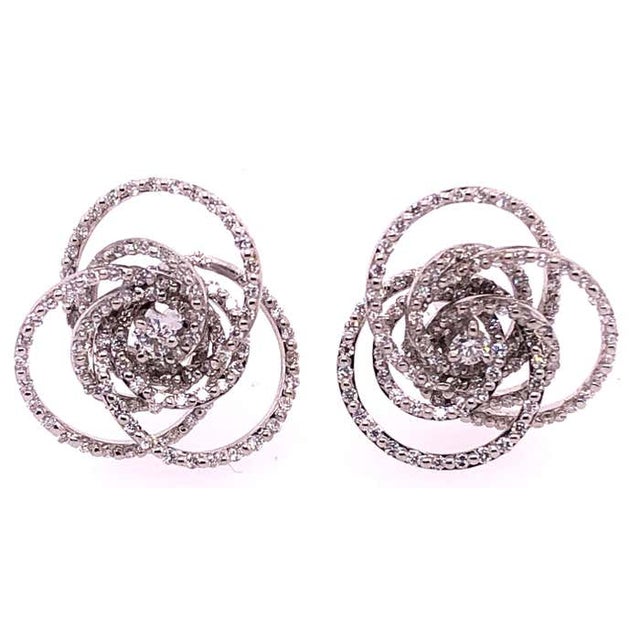 18 Karat White Gold Diamond Flower Swirl Stud Earrings by H2 at Hammerman. H2 at Hammerman diamond swirl stud earrings 18K...