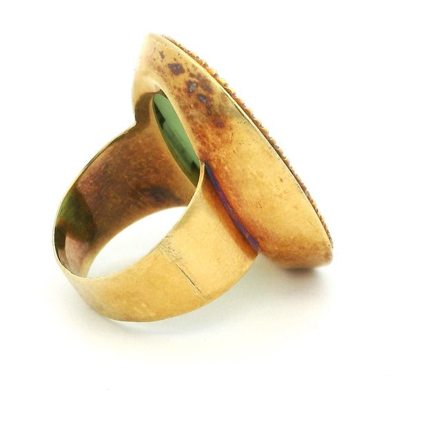 A bold vintage Italian statement ring crafted in solid 18K yellow gold and signed CORLETTO, featuring a luminous oval jade...